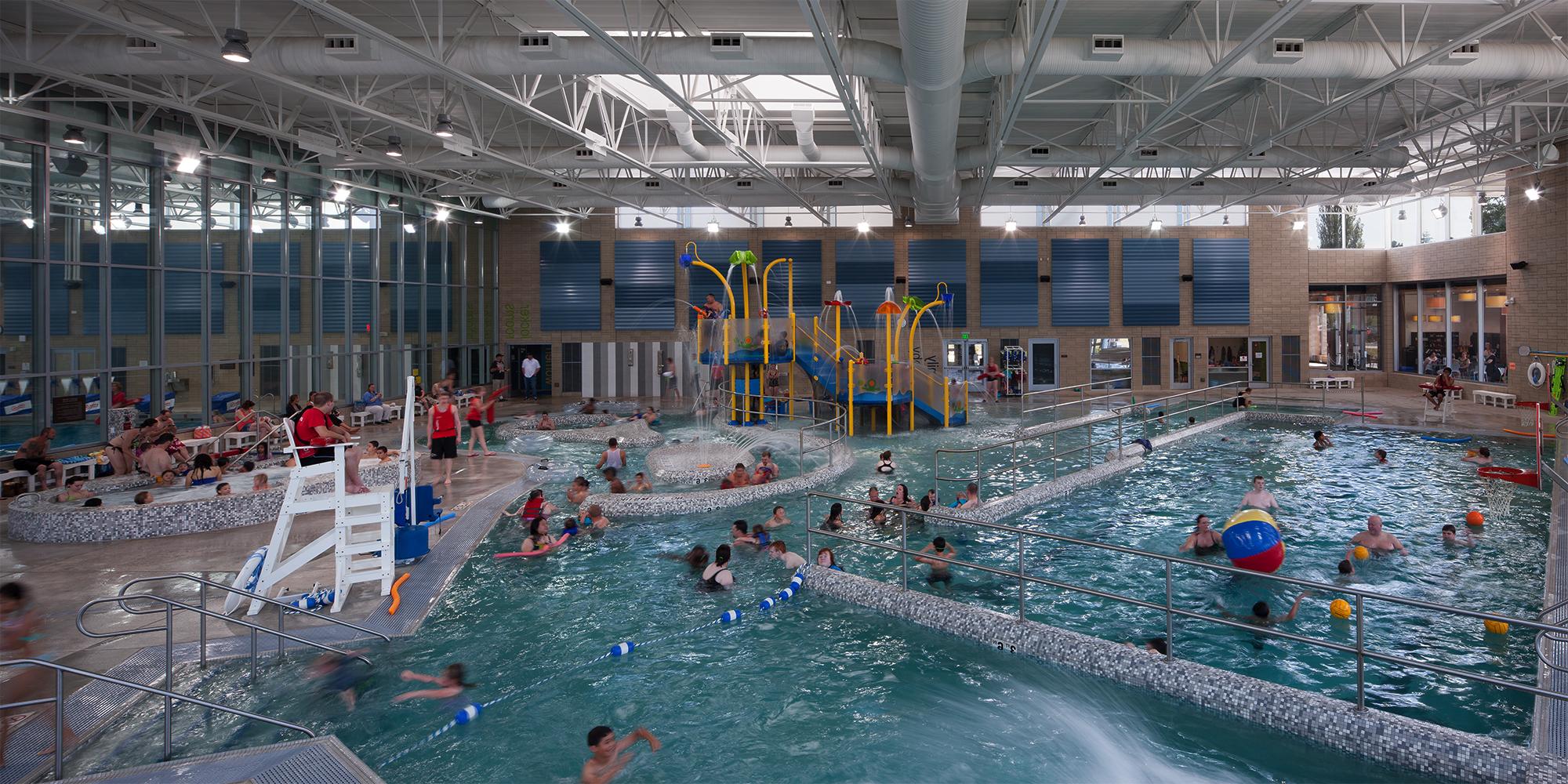 People swimming inside community pool at Snohomish Aquatic Center